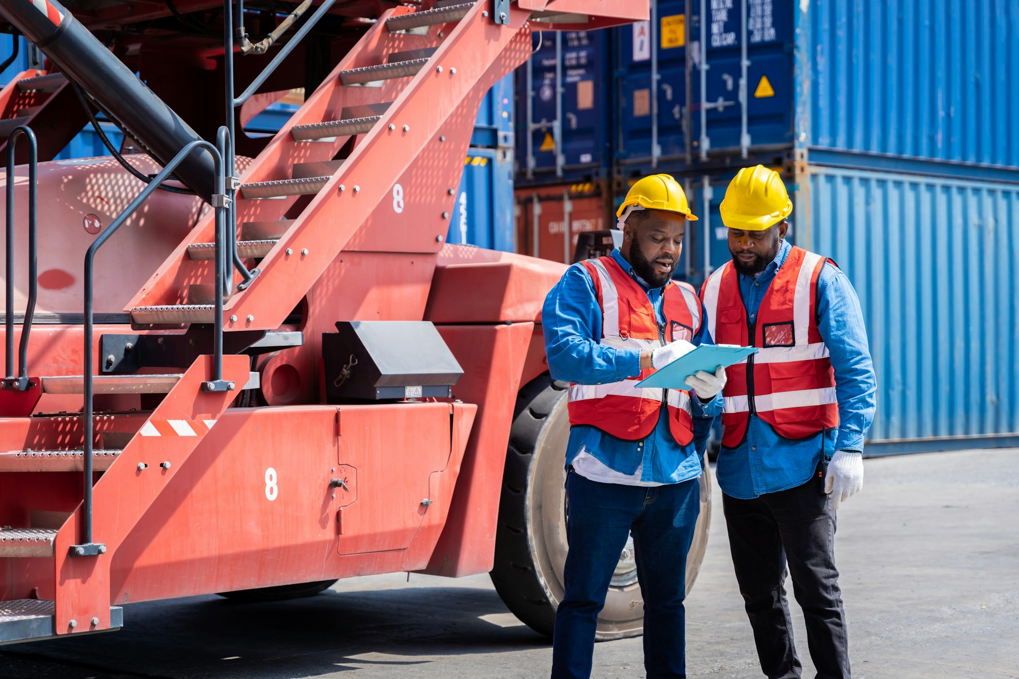 Two male engineers in a container shipping company