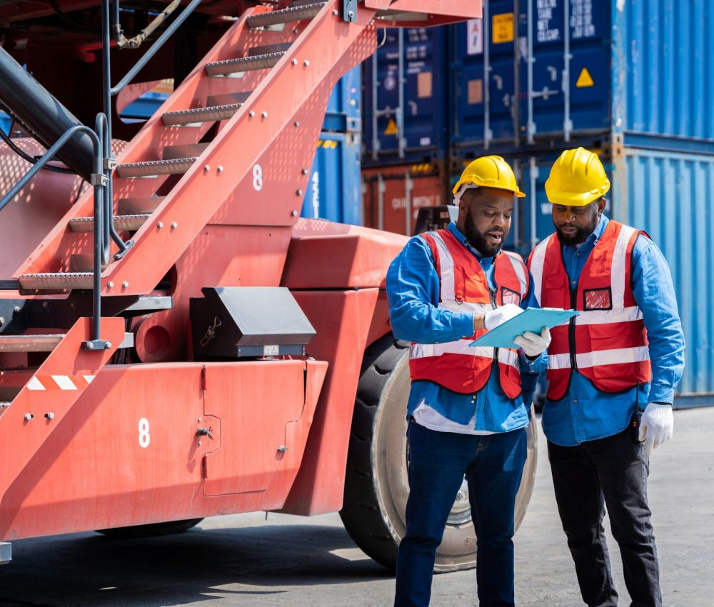 Two male engineers in a container shipping company